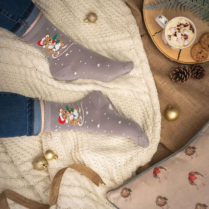 Model wearing grey Christmas mouse in Santa hat socks 