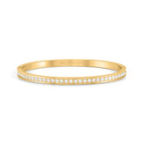 A yellow gold bangle with white CZ strip