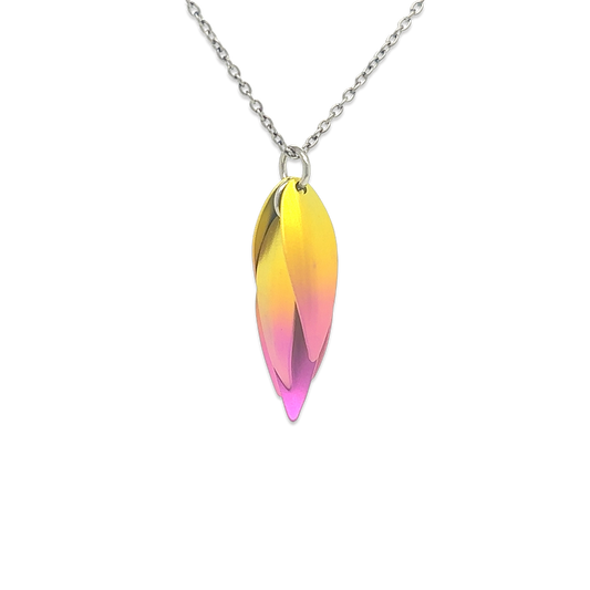 A titanium drop flower shaped pendant with yellow and pink ombre