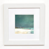 White square framed wall art with print of a seascape from the Isle of Barra in teal blues