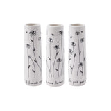 Small cylinder white bud vase with simple black floral pattern and the saying 'If friends were flowers I'd pick you'