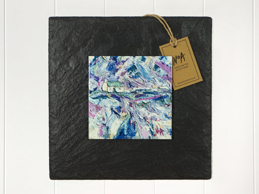  Wall art of a small white cottage in a field of blue, purple, green and yellow in an abstract style onto a square ceramic tile mounted on square slate